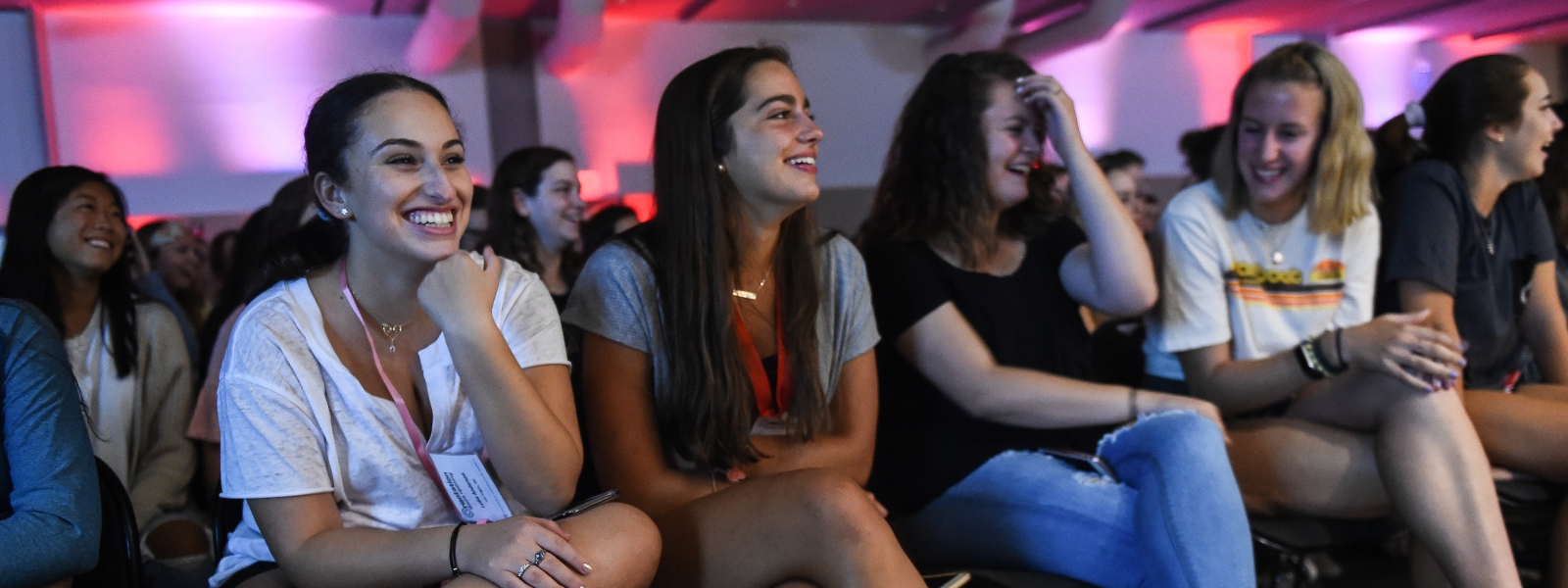 Female students laughing during Orientation event